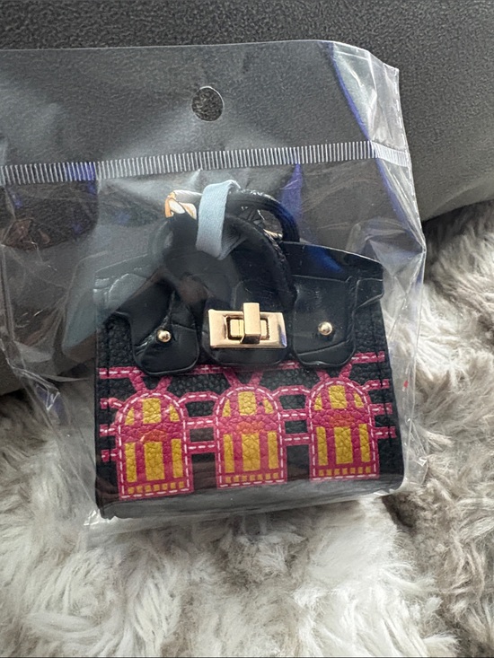 Handbags - Black Mini Embroidered Tote Bag with Pink & Yellow Accents bag charm.
